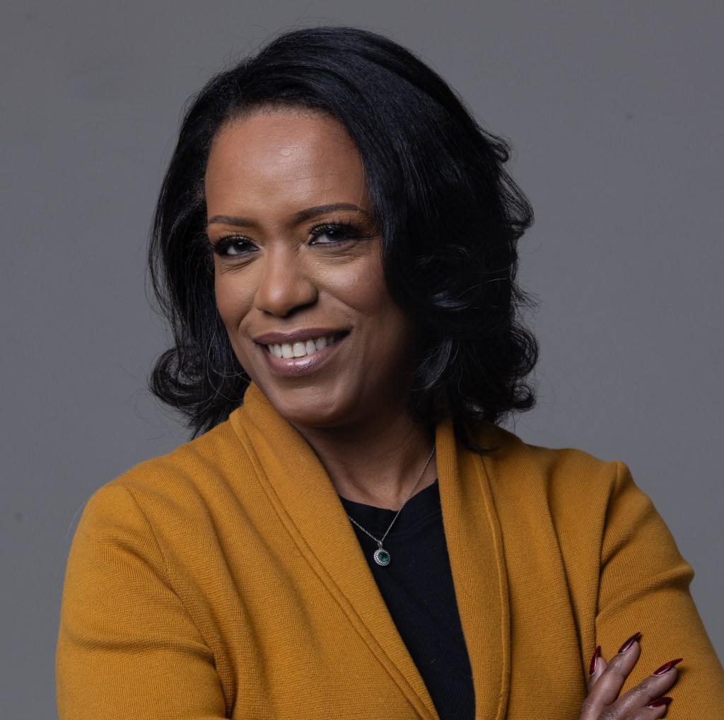 Tanita Gilbert Alexander smiling in professional headshot, founder of InspirHer Wisdom